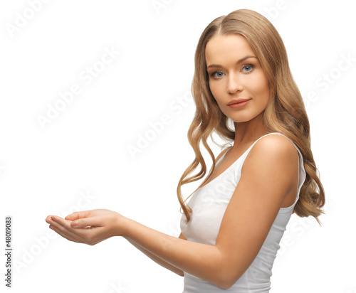 Photo: woman holding something on the palms woman holding something on the palms
