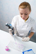 Photo: The woman physician behind work in laboratory The woman physician behind work in laboratory