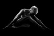 Photo: Naked woman on black background Naked woman on black background