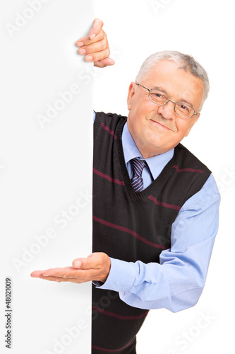 Photo: Gentleman posing behind a blank panel and gesturing Gentleman posing behind a blank panel and gesturing