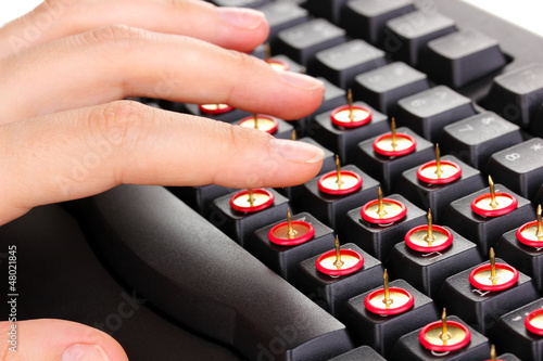 Photo: Painful typing on keyboard close-up Painful typing on keyboard close-up