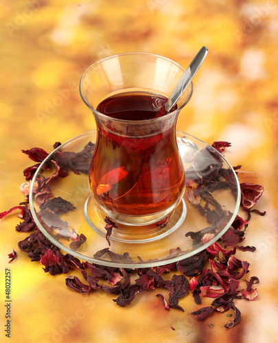 Photo: glass of Turkish tea on color background glass of Turkish tea on color background