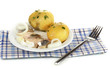 Dish of herring and potatoes on plate isolated on white