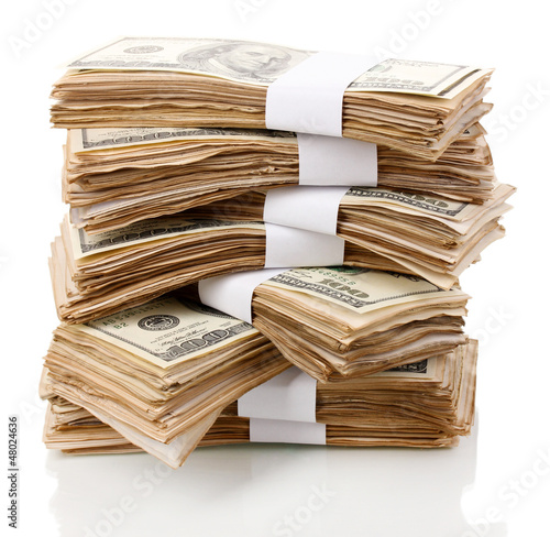 Photo: Stack of one hundred dollars banknotes close-up isolated Stack of one hundred dollars banknotes close-up isolated