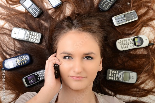 Photo: Girl and smartphone Girl and smartphone