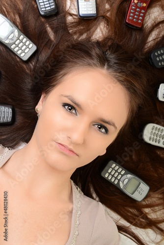 Photo: Girl and smartphone Girl and smartphone