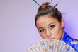 Photo: Portrait of the girl in national clothes and with a fan Portrait of the girl in national clothes and with a fan