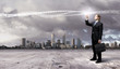 Businessman with colourful light beam in his hands