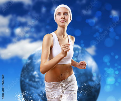 Photo: Young pretty woman in sport wear running Young pretty woman in sport wear running