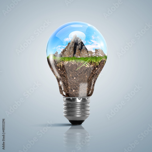 Photo: Lamp bulb with clean nature symbol inside Lamp bulb with clean nature symbol inside
