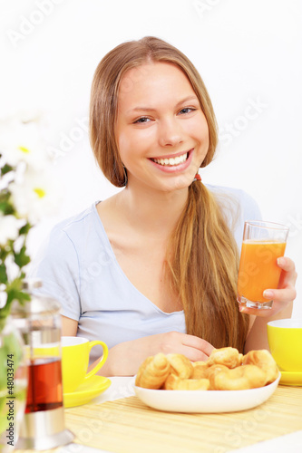 Photo: Beautiful young woman drinking tea Beautiful young woman drinking tea