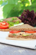 Rye bread sandwich with tuna, tomato slices and cucumber