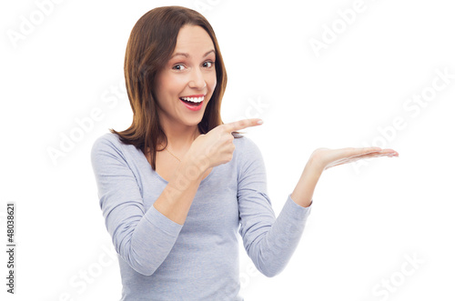 Photo: Excited woman pointing at something Excited woman pointing at something