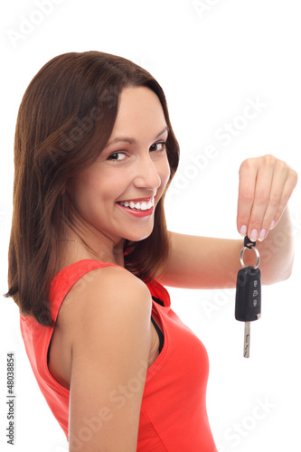 Photo: Smiling woman showing car key Smiling woman showing car key