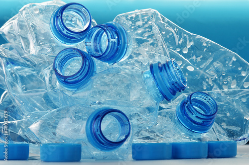 Photo: Composition with empty polycarbonate plastic bottles of mineral Composition with empty polycarbonate plastic bottles of mineral
