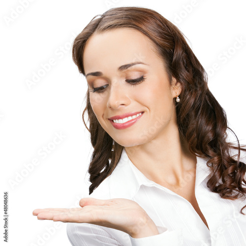 Photo: Businesswoman showing, isolated on white Businesswoman showing, isolated on white
