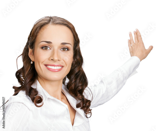 Photo: Businesswoman showing, isolated on white Businesswoman showing, isolated on white
