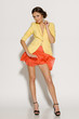 Foto: Full length of fashion model in mini skirt fluttering on wind Full length of fashion model in mini skirt fluttering on wind