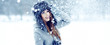 Girl playing with snow in park