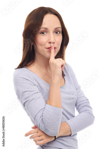 Photo: Woman making silence gesture Woman making silence gesture