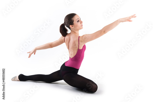 Photo: Young dancer isolated on white background. Ballerina project. Young dancer isolated on white background. Ballerina project.