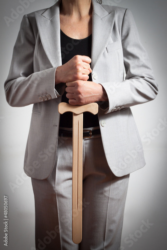 Photo: Woman with wooden sword Woman with wooden sword