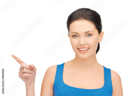 Photo: beautiful woman pointing her finger beautiful woman pointing her finger