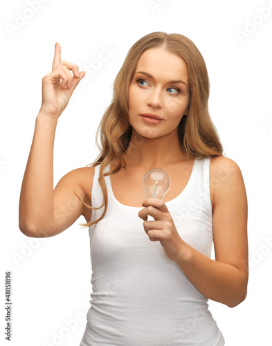 Photo: woman with energy saving bulb woman with energy saving bulb