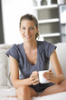 Cute young lady with a cup of coffee