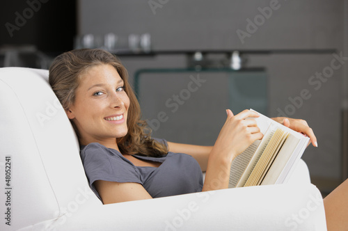 Photo: Beautiful woman reading a book Beautiful woman reading a book