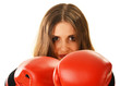 Portrait of young woman with red boxing gloves