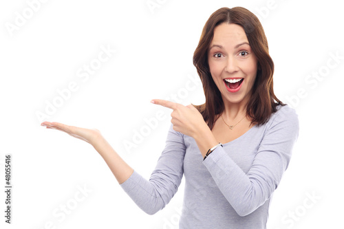 Photo: Excited woman pointing at something Excited woman pointing at something