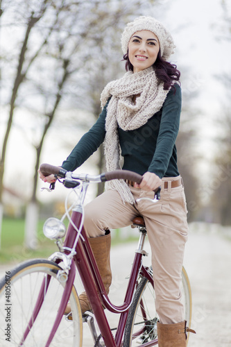 Photo: Young woman on the bicycle Young woman on the bicycle