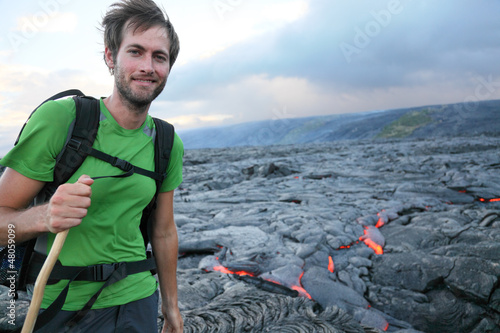 Photo: Hawaii hiker hiking by flowing lava Hawaii hiker hiking by flowing lava