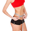 Woman measuring waist with a tape measure, isolated on white