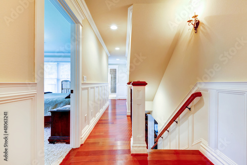 Photo: Large bright hallway with cherry hardwood and staircase. Large bright hallway with cherry hardwood and staircase.