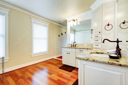 Photo: Luxury large white master bathroom with cherry hardwood. Luxury large white master bathroom with cherry hardwood.