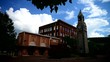 Timelapse of town square with rolling clouds and blue sky