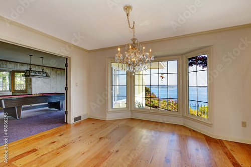 Photo: Large old room with pool table and dining room. Large old room with pool table and dining room.