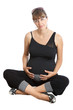 A pregnant woman, 9 months, holding her tummy