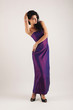 Photo: Portrait of sensual brunette caucasian woman with purple dress. Portrait of sensual brunette caucasian woman with purple dress.