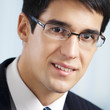 Happy smiling businessman at office