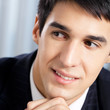 Portrait of thinkihg businessman at office