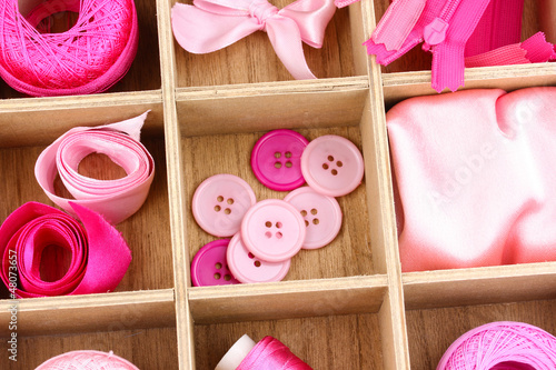 Photo: Material for sewing in wooden box closeup Material for sewing in wooden box closeup