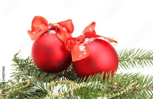 Photo: Christmas balls on fir tree with snow, isolated on white Christmas balls on fir tree with snow, isolated on white