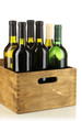 Wine bottles in wooden box isolated on white