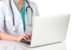Doctor using laptop computer isolated on white