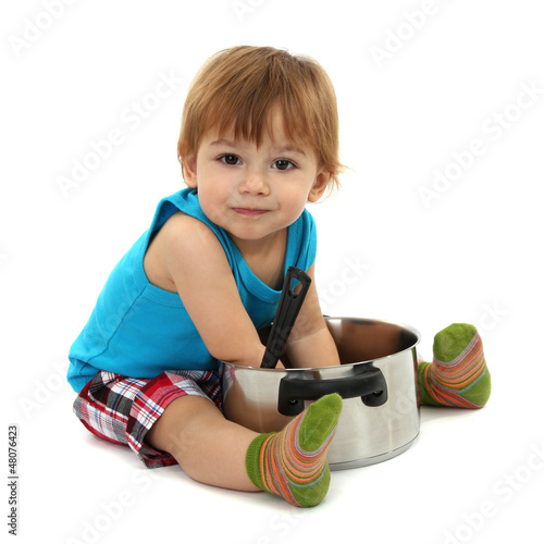 Photo: cute little boy with casserole, isolated on white cute little boy with casserole, isolated on white