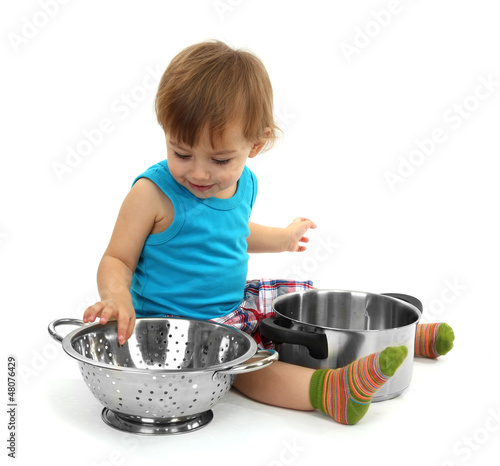 Photo: cute little boy with kitchen accessories, isolated on white cute little boy with kitchen accessories, isolated on white