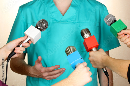 Photo: Conference meeting microphones and doctor Conference meeting microphones and doctor